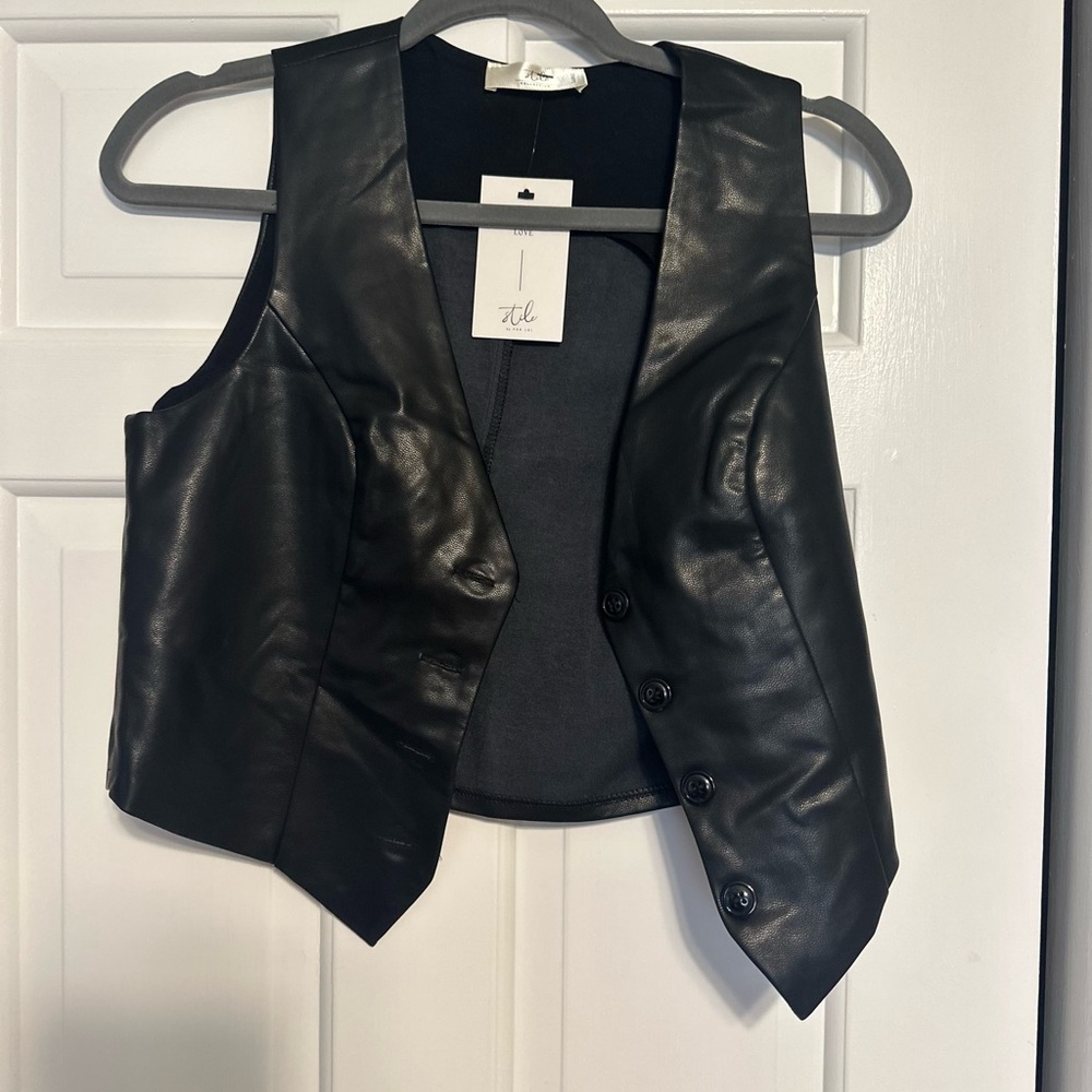 Stile leather vest. New with tags. 60